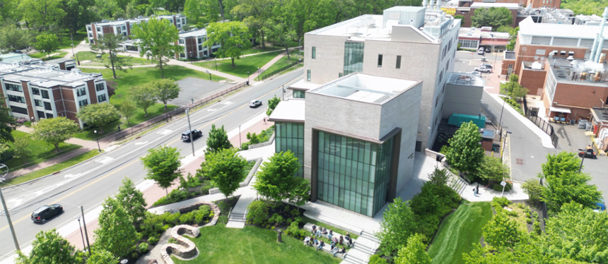 GPS Faculty and staff sitting at the base of Discovery Hall on Mullica Hill Road
