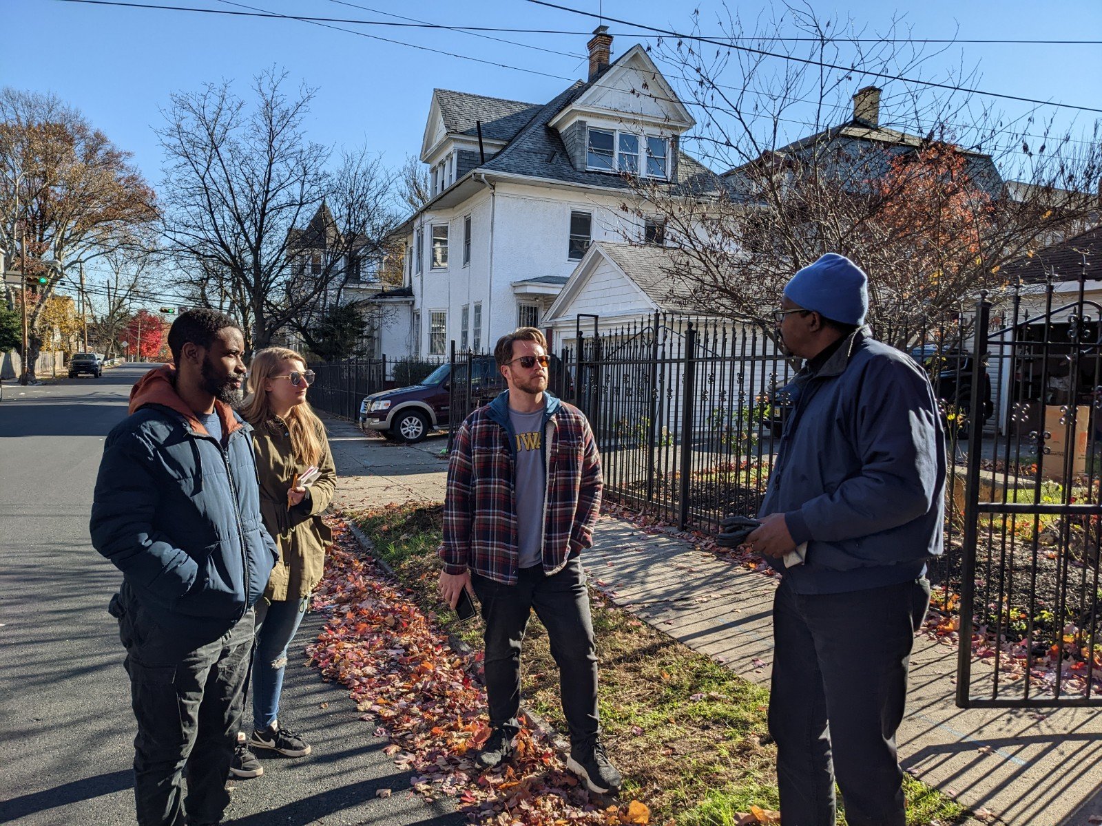 DPS students Ibrahim Waziri, Renee Wolf, and Jesse Weber talking with Charles, a Newark Resident (photo credit Joseph Conte)