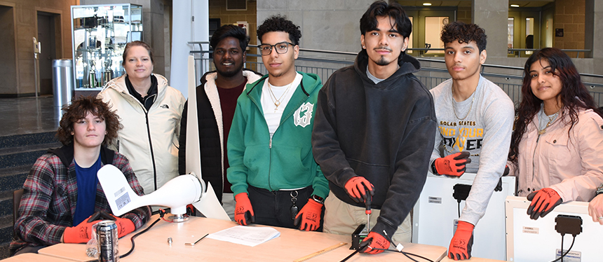 kids at a table working on a project
