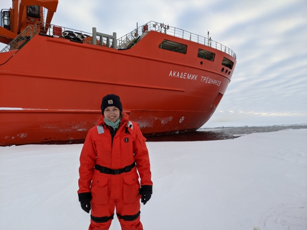 Lauren Kipp In front of a large ship
