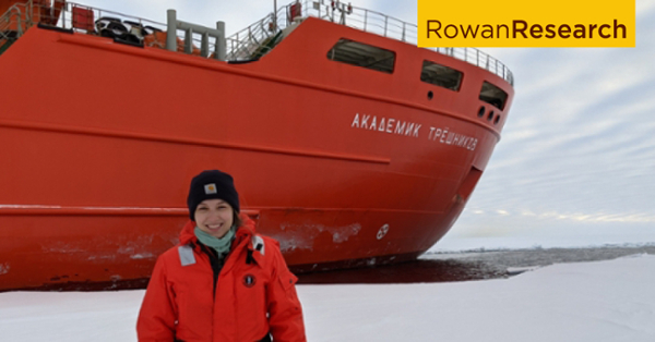 Lauren Kipp In front of a large ship