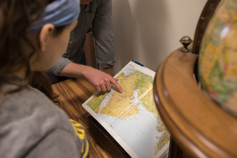 Student examining a map